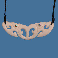 Necklace with a decorative bone pendant on a blue background