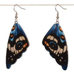 Butterfly wing earrings on a white background