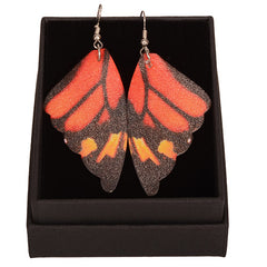 Butterfly wing-shaped earrings on a white background