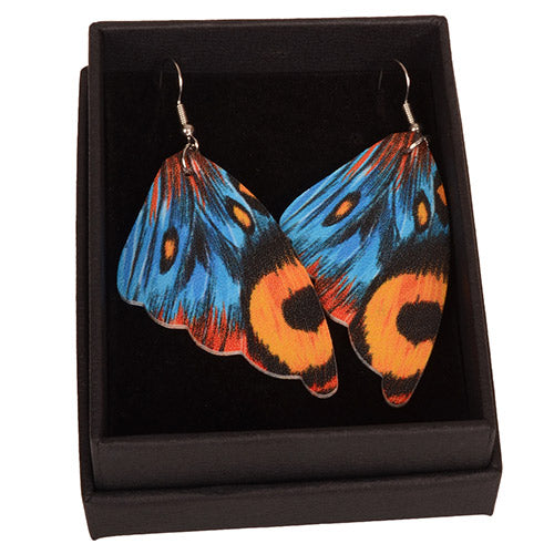 Butterfly wing earrings with blue, yellow, and black design on a white background