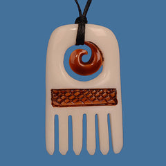 Bone Stained comb pendant pictured on blue background