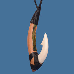 Hook pendant with black cord on a blue background