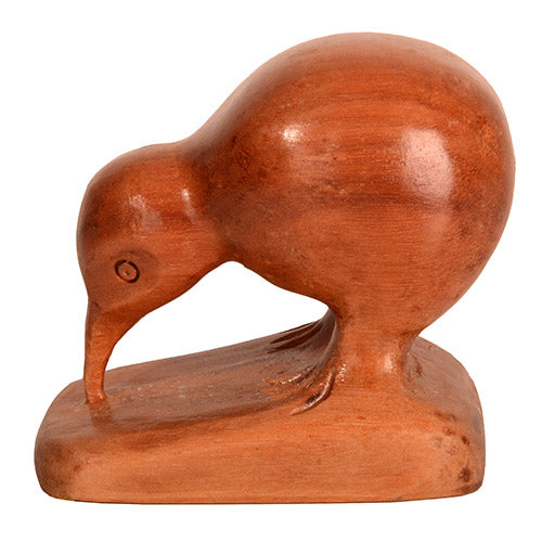 Wooden sculpture of a kiwi bird on a white background