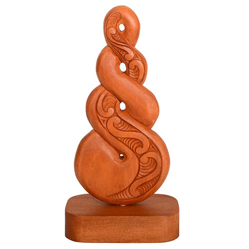 Wooden carvings with intricate patterns on a white background