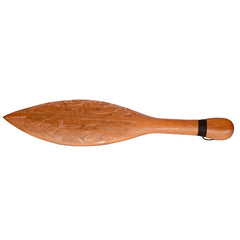 Wooden paddle with intricate carvings on a white background
