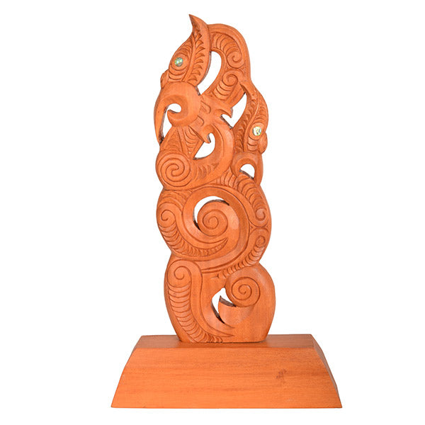 Wooden carvings with intricate designs on a white background