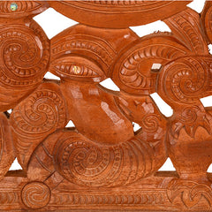 Wooden decorative lintel with intricate carvings on a white background