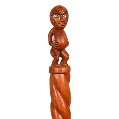 Wooden decorative stick with a carved top on a white background