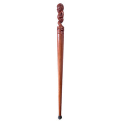 Wooden decorative staff with a carved top on a white background
