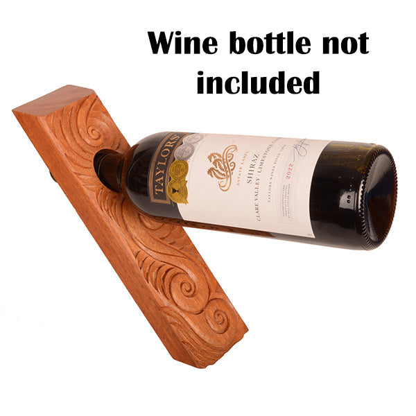 Wooden bottle holder with carvings on a white background
