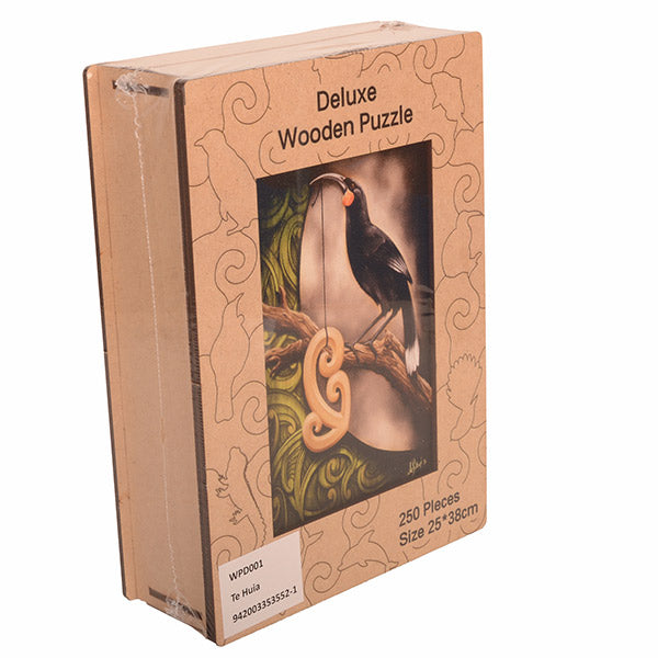 Box of a deluxe wooden puzzle with a bird design on the cover