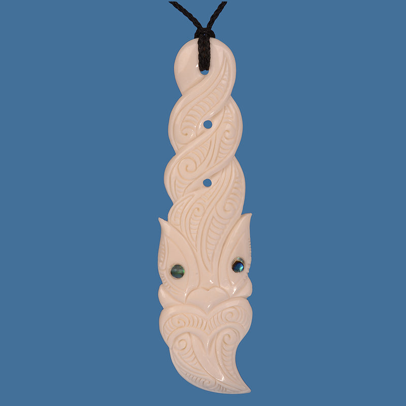 Beautiful Extra Large Bone Tiki Twist Pendant on an adjustable braided cord.