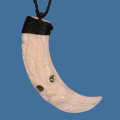 Pig tusk pendant with tiki face. BTP002